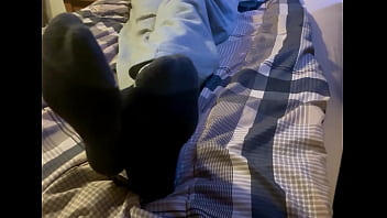 Teen boy feet on bed