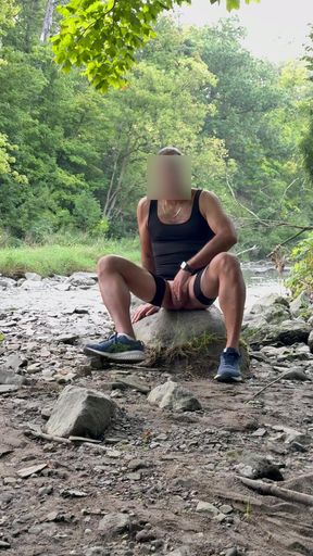 Posing outdoors by a Creek.