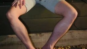 amateur boy pees himself in the garden (wets his grey shorts, grey undies and white tshirt)