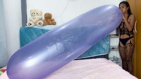 Sexy Camylle Sensually Blows To Pop A Huge Purple Printed Zeppelin Balloon