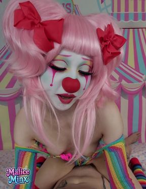 Clown makeup and pink hair