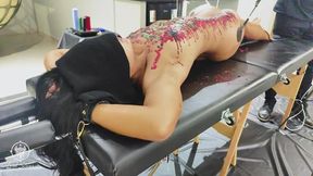 BDSM slave punished with spanking and wax play