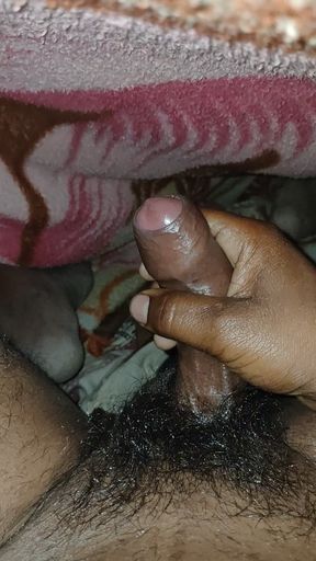 Big Boss massaging penis oil under the blanket