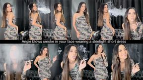 Angie blows smoke in your face wearing a skintight short dress