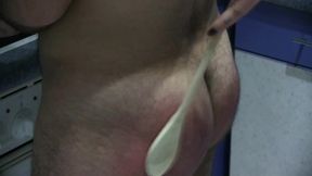 Beating him with wooden spoon to cook better