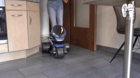 Electrical Motobike under two booted Girls and shredder