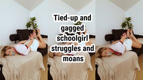 Hands & feet are tied, mouth sealed with gray tape