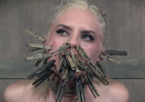 Blonde slender white chick got her face clipped with cloth pins