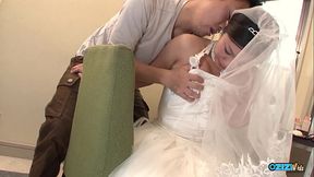 The new asian wife is still dressed in her wedding gown when someone visited her
