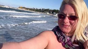 Topless MATURE pisses on public beach while jogging