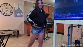 Posing, swaying my ass around as well as pissing in my jean shorts and getting undressed afterwards