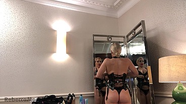 Rebecca More from Naked into a Sexy Latex Outfit Reverse Striptease