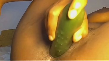 Sexy diva fuck her black pussy with a big cucumber