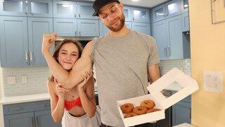 Daisy Fox playing with donuts and her muscular partner