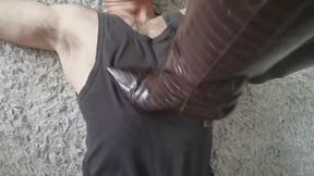 leather boots dominating his neck and face