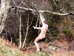 Naked self-bondage in the woods gone wrong.