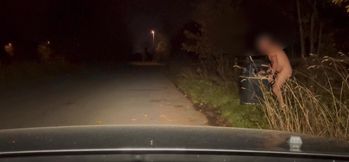 Naked and Jerking barefoot with full beams on at side of road