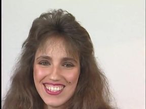 Beautiful brunette enjoys filling her pussy with a dildo