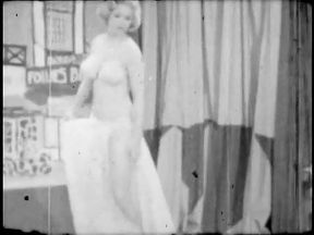 Strip-tease of a blonde woman in the sixties