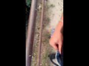 Twink piss from the bridge into the river