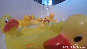 Nadia takes a bath with some rubber duckies