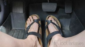 Fifi pedal pumping in Birkenstocks in a store parking lot