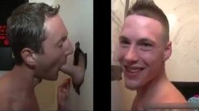 Horny dude gets his boner sucked through hole in the wall