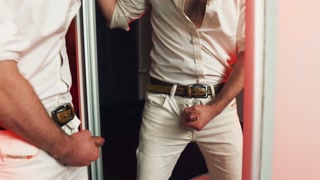 A handsome guy masturbates in front of a mirror. I finish loudly and fill the mirror with my sperm.