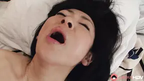 Japanese brunette Milf Emiko Koike blows her husband's hard cock uncensored.