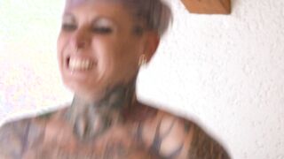 Tattooed Grman Milf with short hair fucking in her black stockings