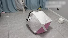 GG118-A barefoot Asian girl is bound within a die made of six carpets.