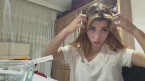 HANDY SHE EXAMINES HERSELF AND SMOKES HER CIGARETTE