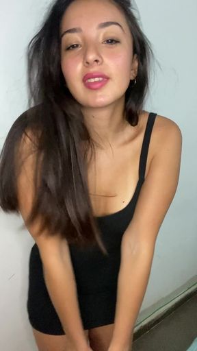 Woman in black leotard posing