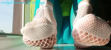 Hot Japanese babe gives a sensual foot massage with slippery toes.