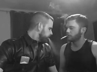 Two Muscular Guys Smoking And Kissing