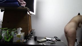 Sexy brunette doing naked chores around the house