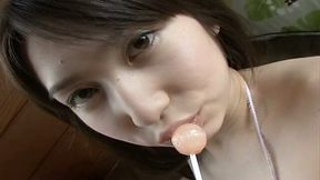 Horny student Kaori Ishii sucks a lollipop and desires to masturbate