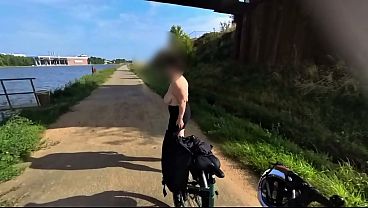 MILF rides a bike naked with big natural boobs