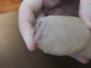 A closeup uncut precum and cumshot