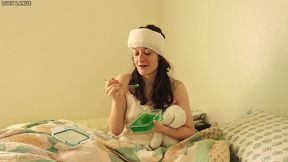 sick girl eats green jello snack