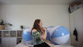 Saskia pops big Ticktacktoo beach balls