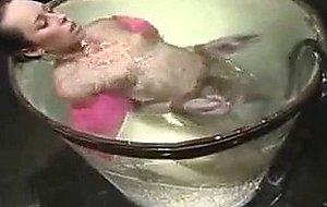Water pounds the breasts of Alexa Von Tess