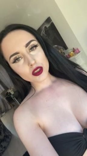 Casually smoking a cork cigarette with dark lipstick on