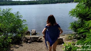 Walking naked along the river bank.