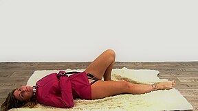 Woman in pink leather straitjacket and chastity belt