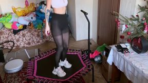 A girl in black tights and sneakers jumps on a trampoline, then takes off her tights and sneakers and jumps in her panties and barefoot. foot fetish nice ass jumping