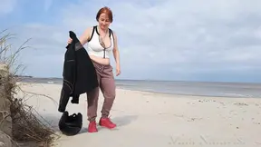 Biker babe strips bare & rubs her hot pussy on the wild beach