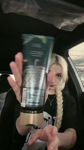 Hand holding tube of lotion