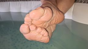 Girlfriend shows her cute feet in the hot tub