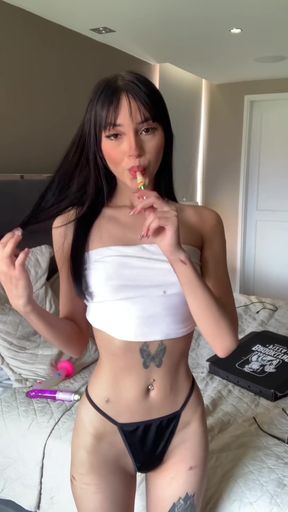 Busty tattooed babe shows off her big ass and thong piercing